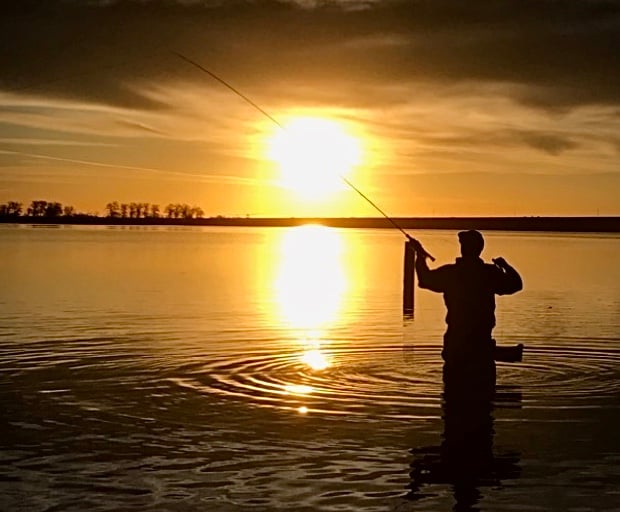 Fly fishing at sunrise at Union Reservoir in Colorado